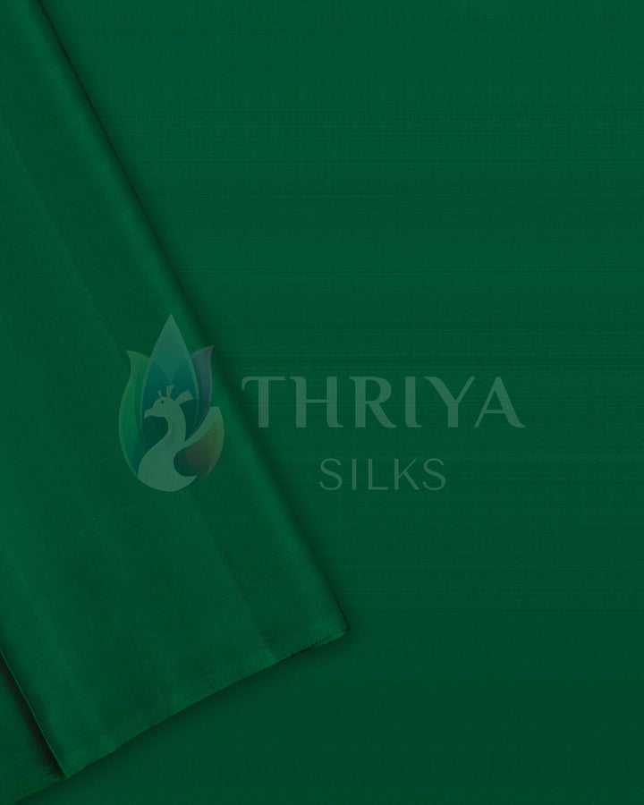 Plain green silk blouse piece matching the saree, from Thriya Silks
