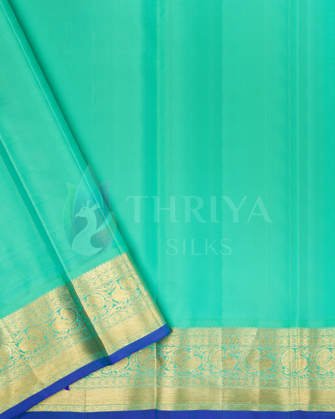 Sea green blouse piece with gold zari border from magenta silk saree