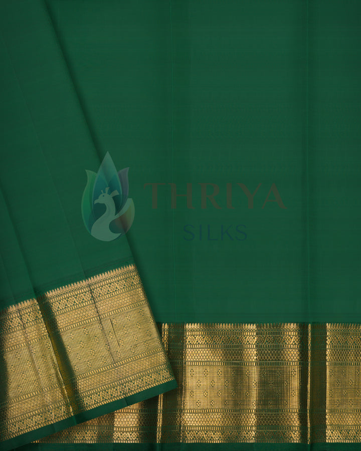 Dark green plain silk blouse piece with gold zari border – part of Kanjivaram saree set by Thriya Silks