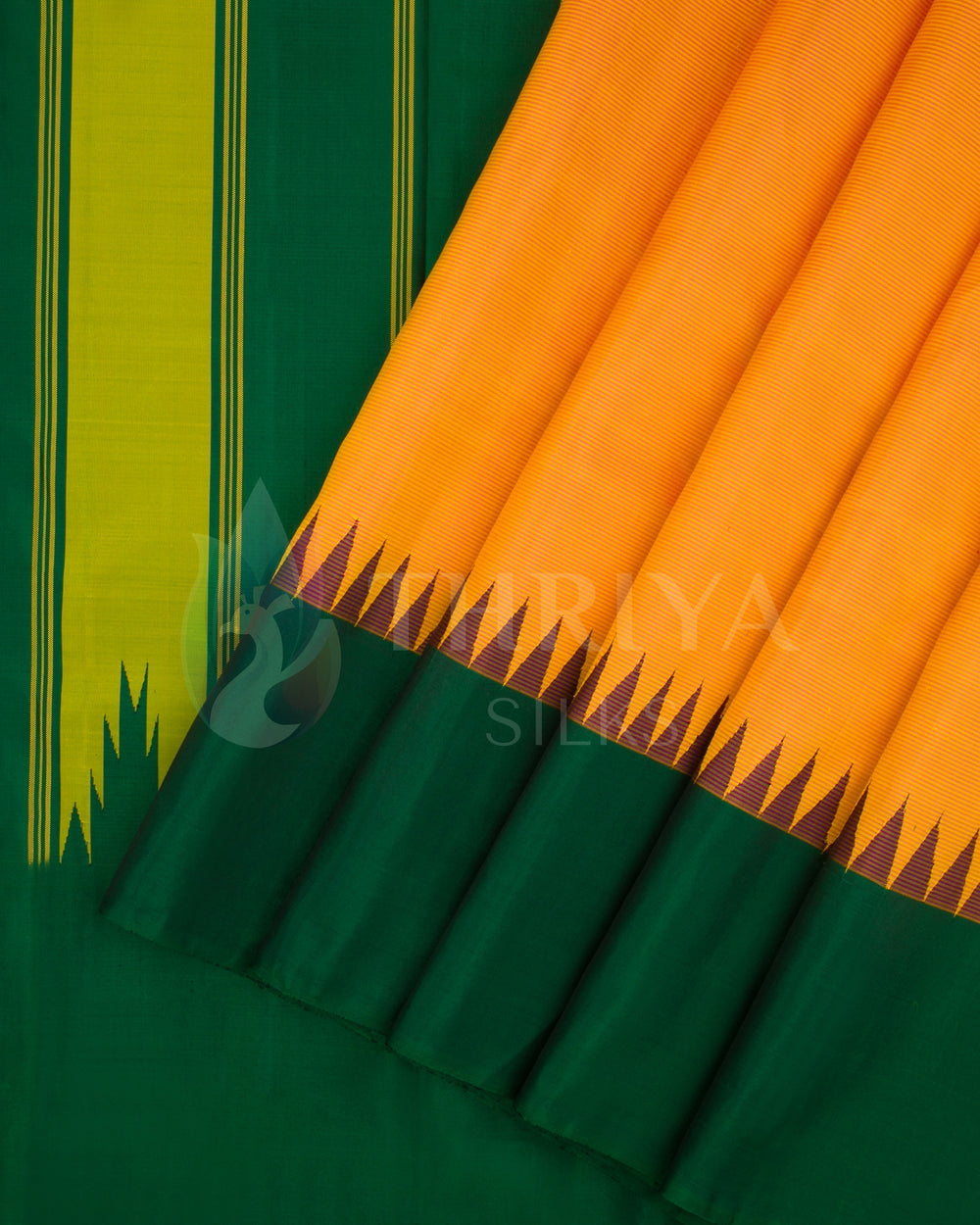 Green silk saree with orange pallu and contrasting border showing pleats, from Thriya Silks