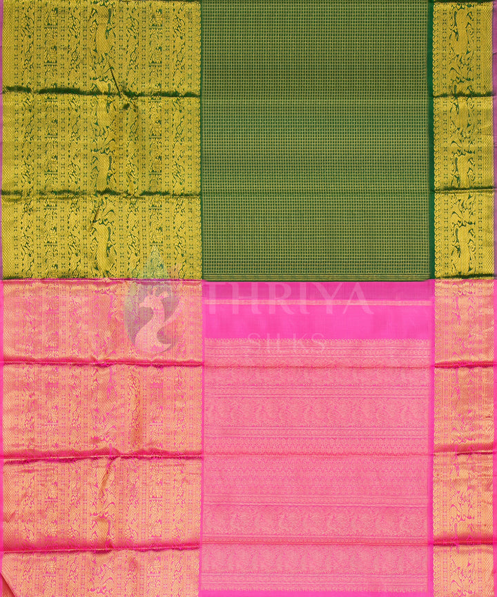 Elegant Kanchipuram silk saree with contrasting green and pink blocks and intricate zari work