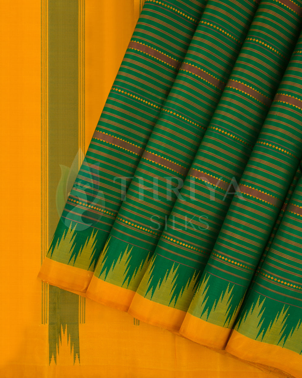 Green silk saree pleats with yellow border featuring traditional geometric patterns, from Thriya Silks