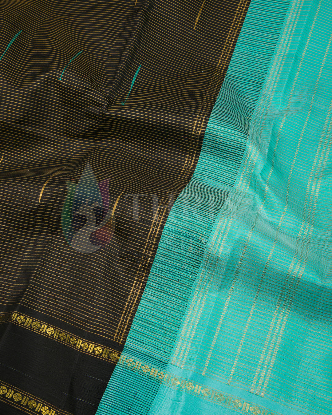 Close view of pallu and body weave pattern of black silk saree with turquoise pallu and zari by Thriya