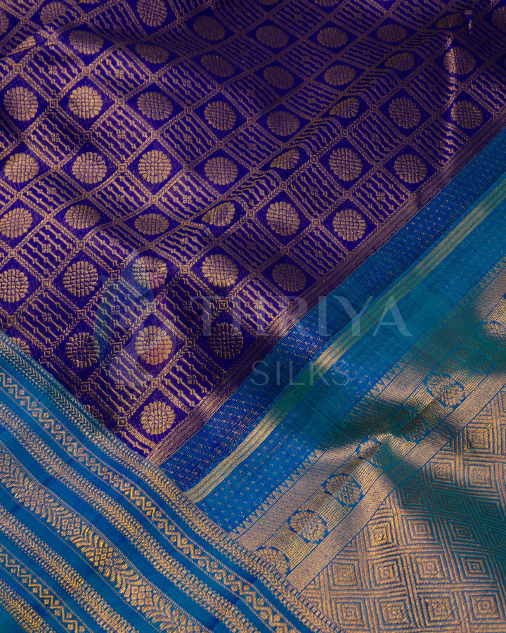 Close-up of purple jacquard Kanjivaram silk saree with blue and gold zari border
