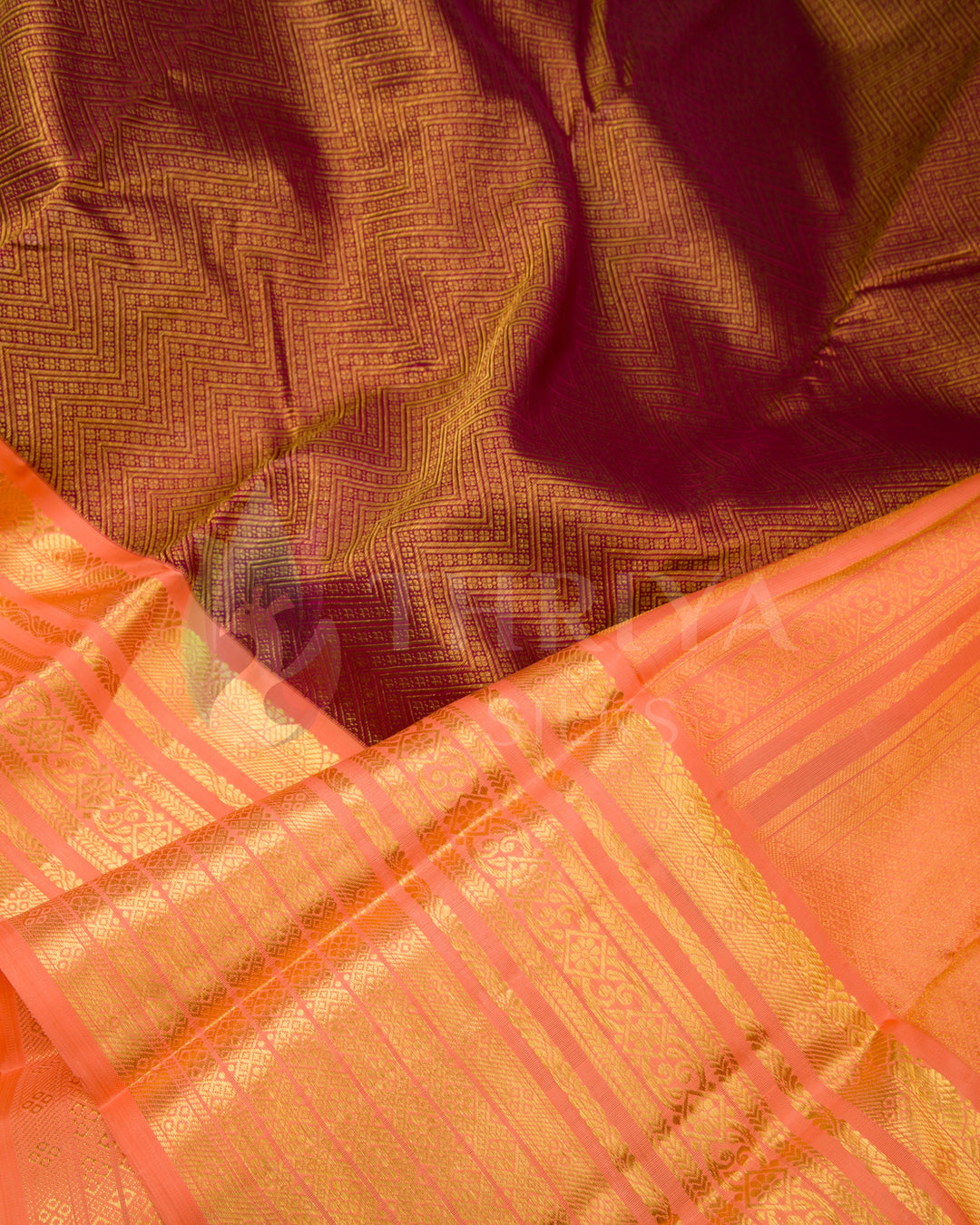Detailed fabric texture of Kora silk saree in peach and maroon with zari work