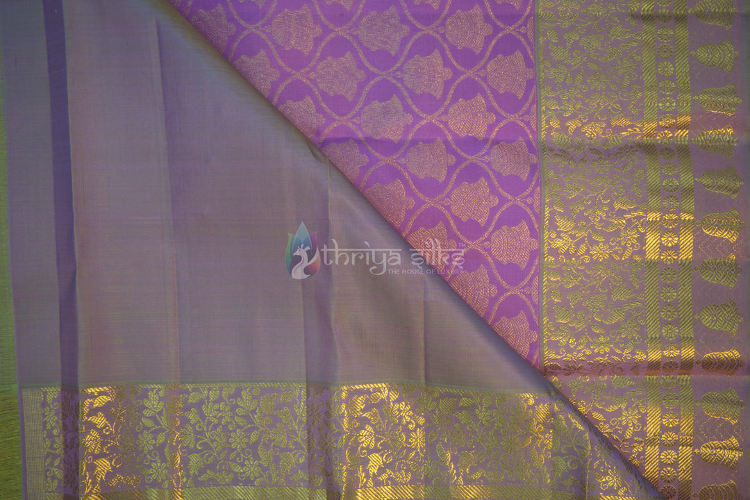 Lavender Kanchipuram silk saree fabric detail with diamond motifs and copper zari