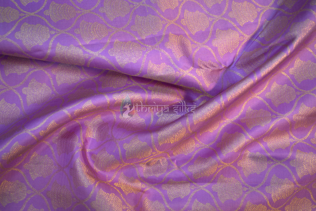 Full view of lavender Kanchipuram silk saree with golden zari border and intricate weave