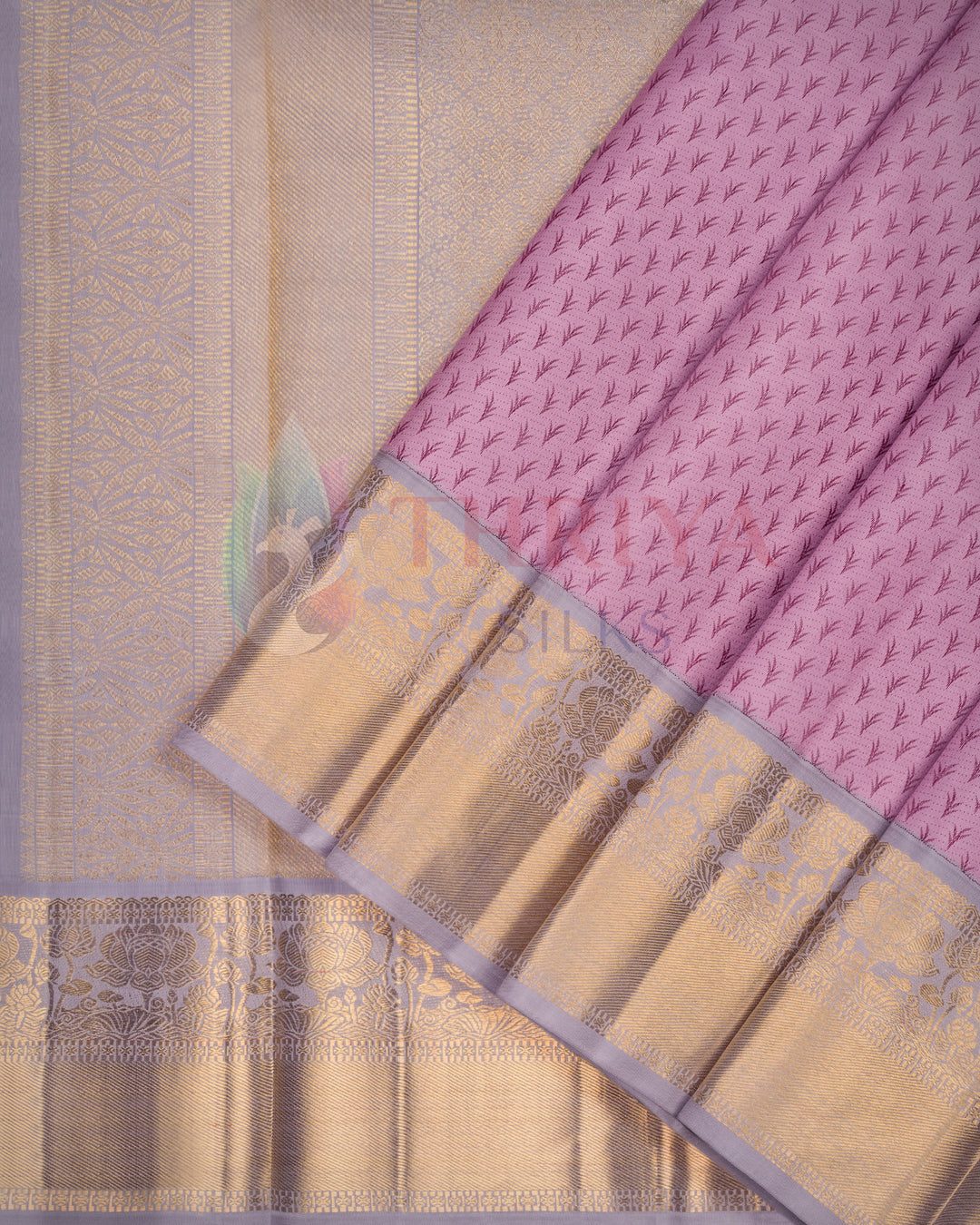 Elegant lavender Kanjivaram silk saree with intricate gold zari border and floral motifs – perfect for weddings and festivals
