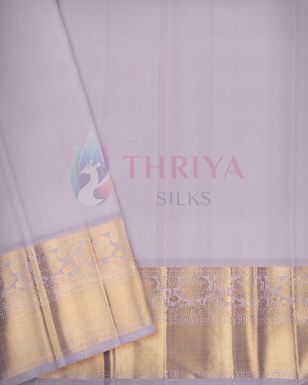 Elegant light lavender silk saree featuring rich golden zari border – Thriya Silks