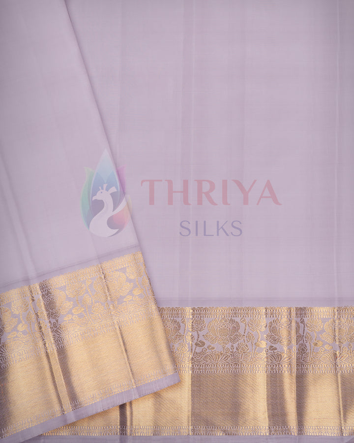 Elegant light lavender silk saree featuring rich golden zari border – Thriya Silks