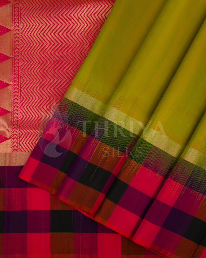 Lime green Kanjivaram silk saree with vibrant pink zari pallu and multicolor checked border