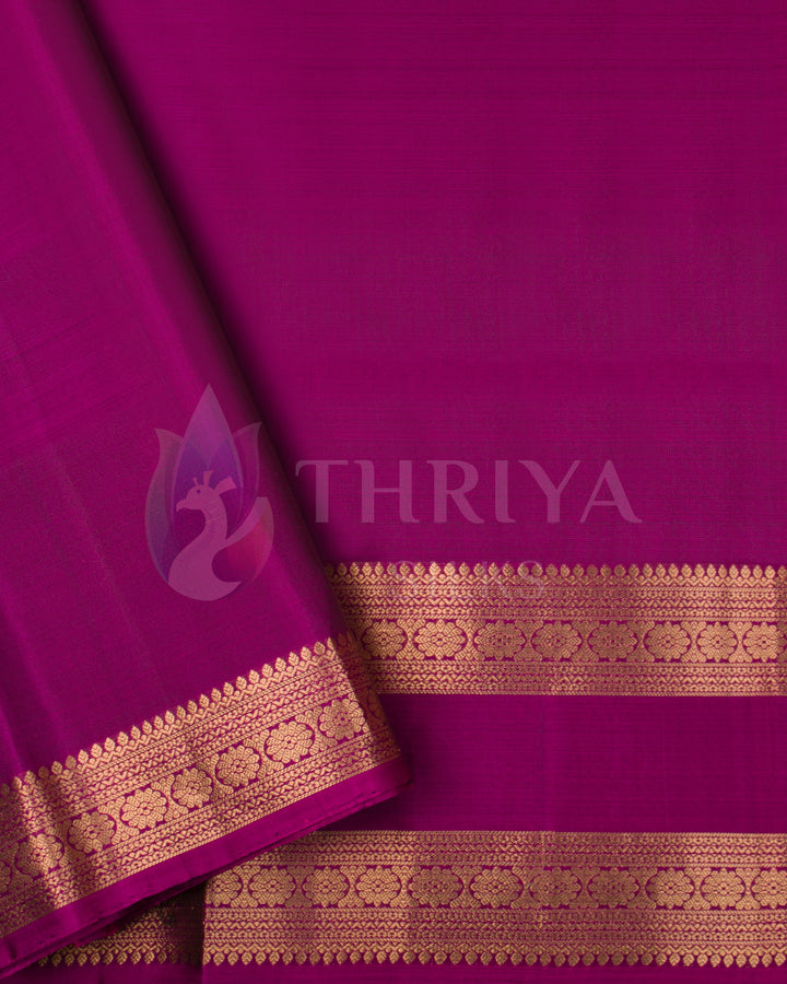 Matching magenta blouse with intricate zari border for Kanjivaram silk saree
