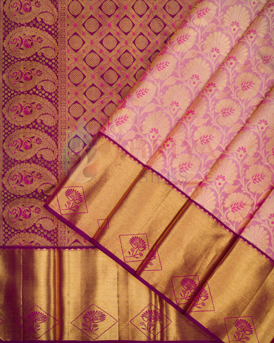 Pleats view of Kanjivaram silk saree in magenta with gold zari border and floral pallu