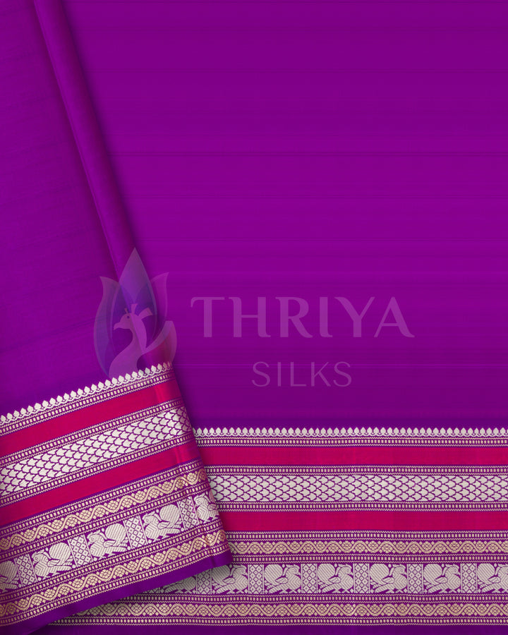Plain magenta blouse piece with rich silver zari border matching the saree from Thriya Silks