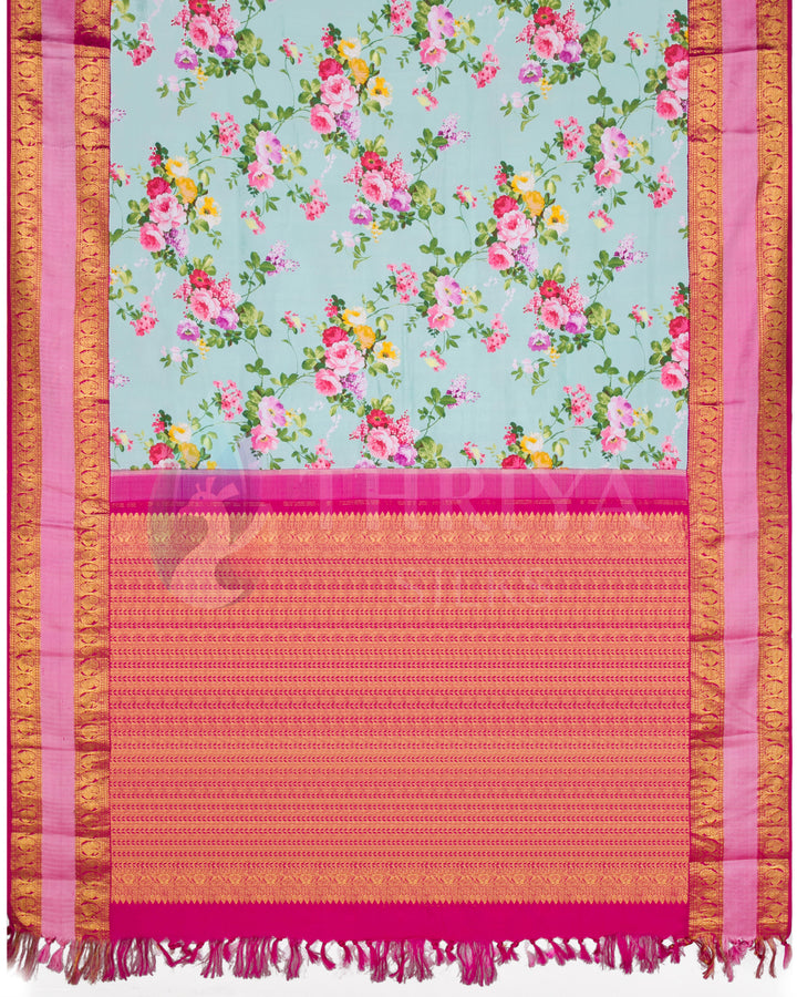 Full pallu view showing mint green body with all-over floral pattern and detailed pink zari pallu