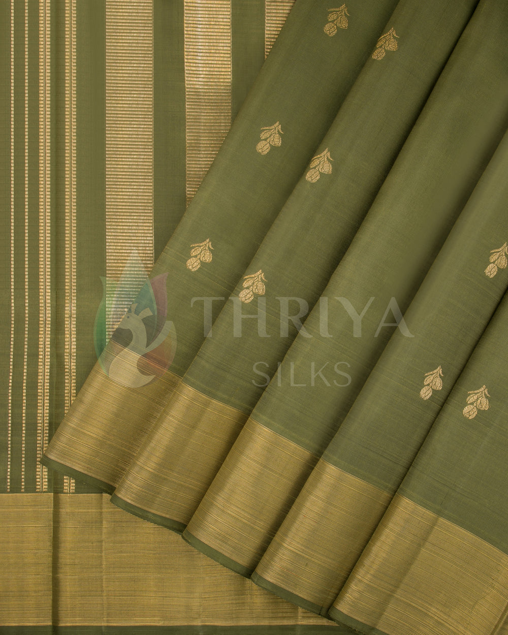 Pleated view of olive green Kanjivaram silk saree with golden zari border and butta motifs