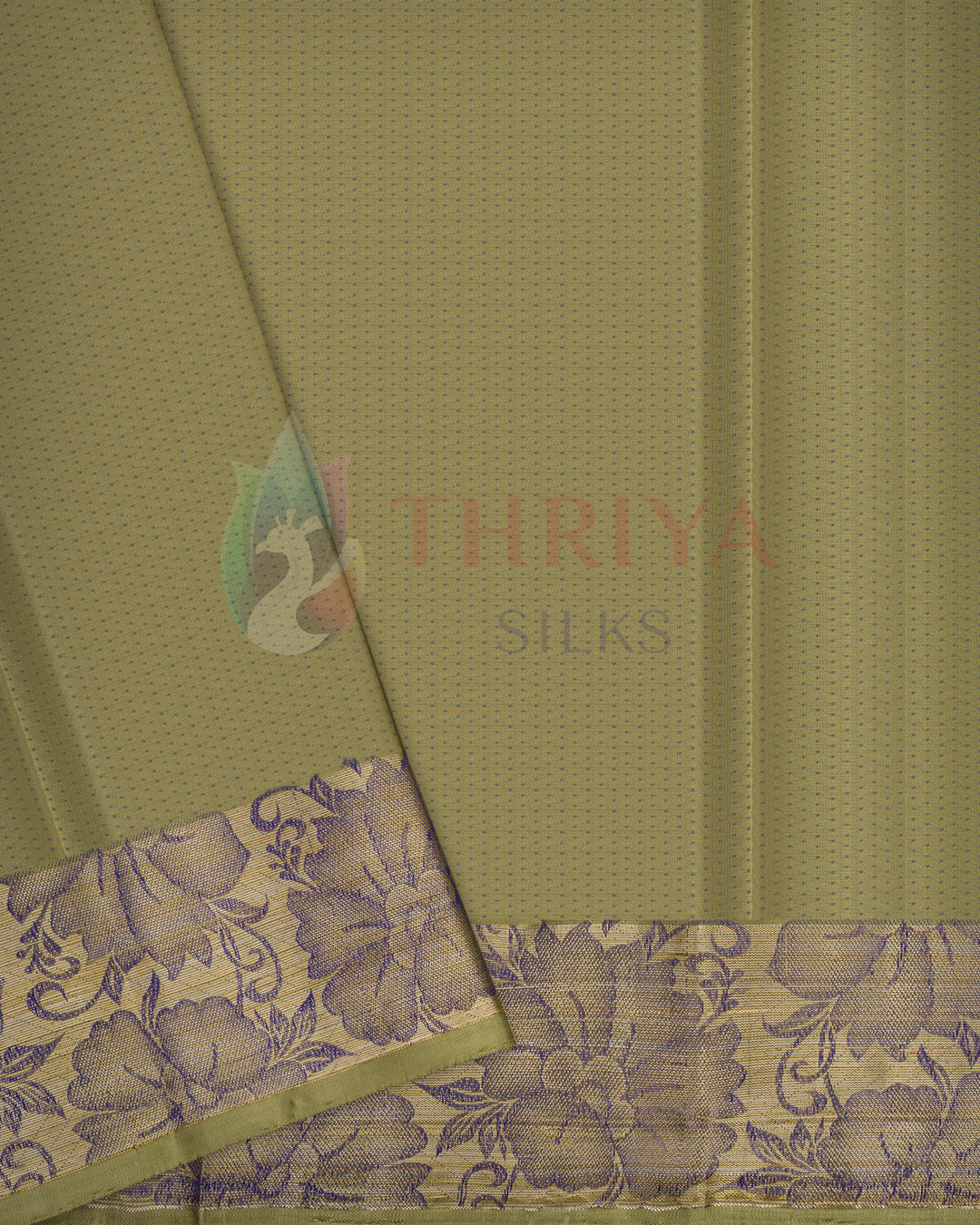 Close-up of olive green silk saree pallu with purple floral zari border