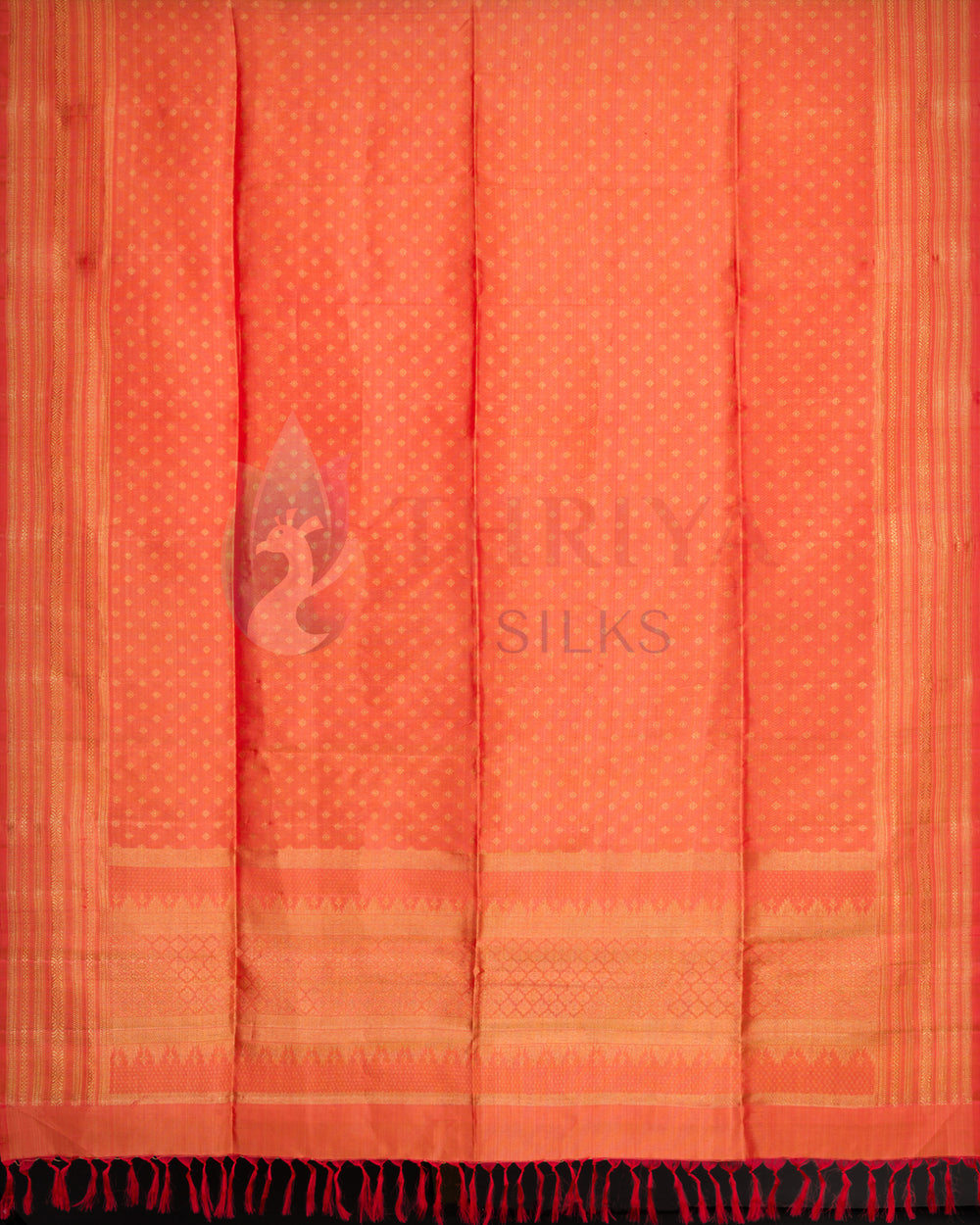 Ethnic orange dupatta with golden zari accents and vibrant red tassels