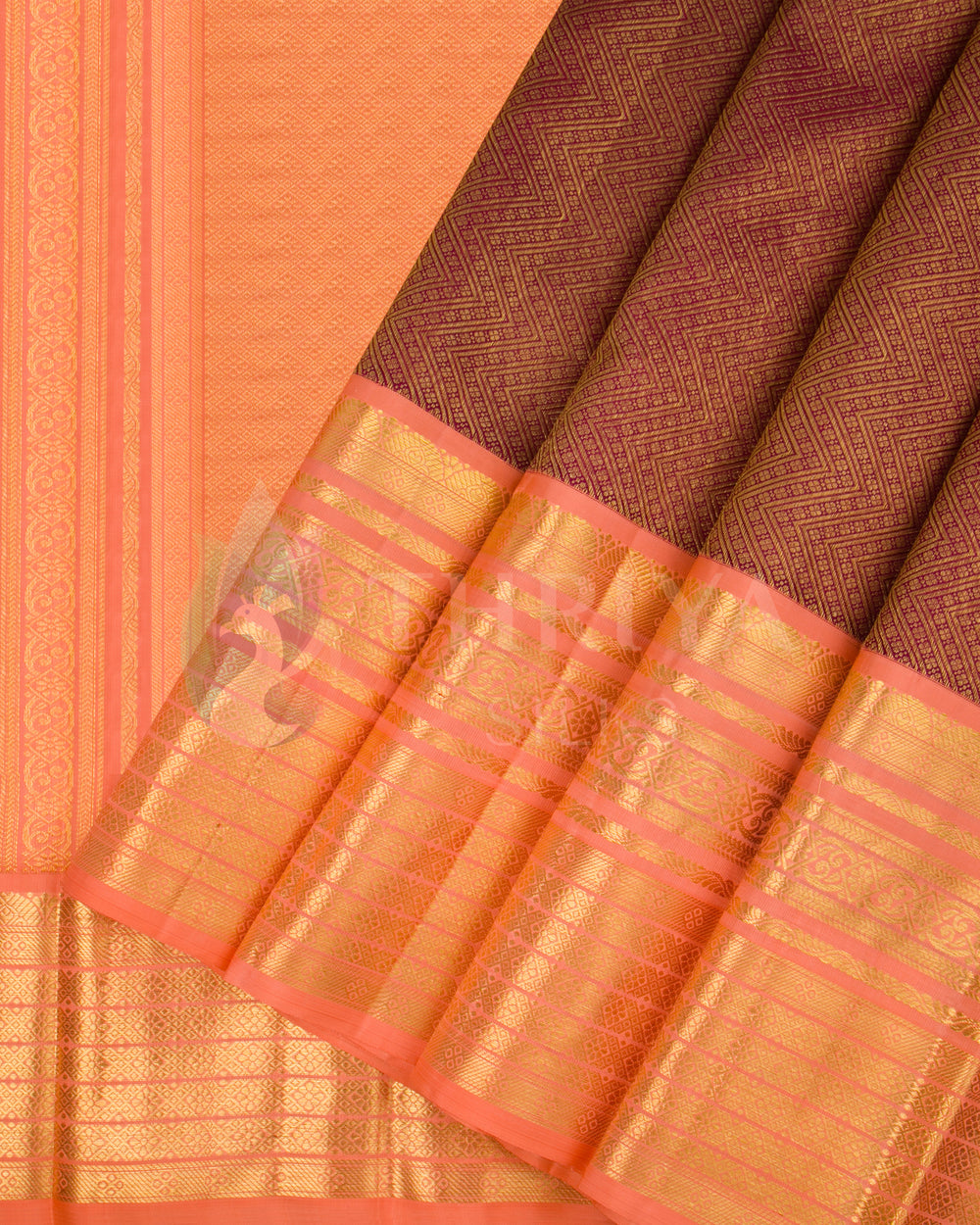 Pleats and folded pallu of peach Kora silk saree with golden zari design