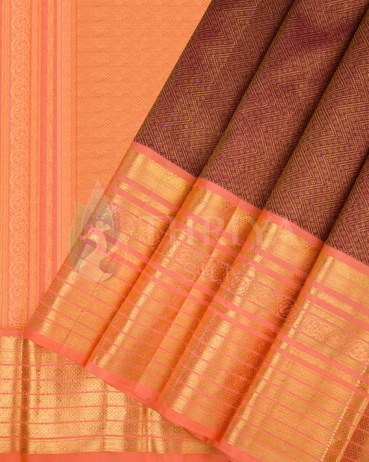 Pleats and folded pallu of peach Kora silk saree with golden zari design