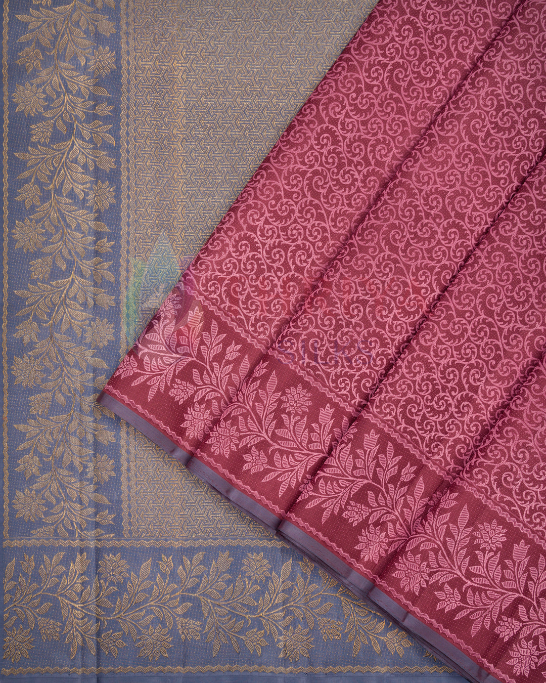 close-up of peach pink Kanjivaram silk saree with copper gold zari and traditional geometric weaving – Thriya Silks