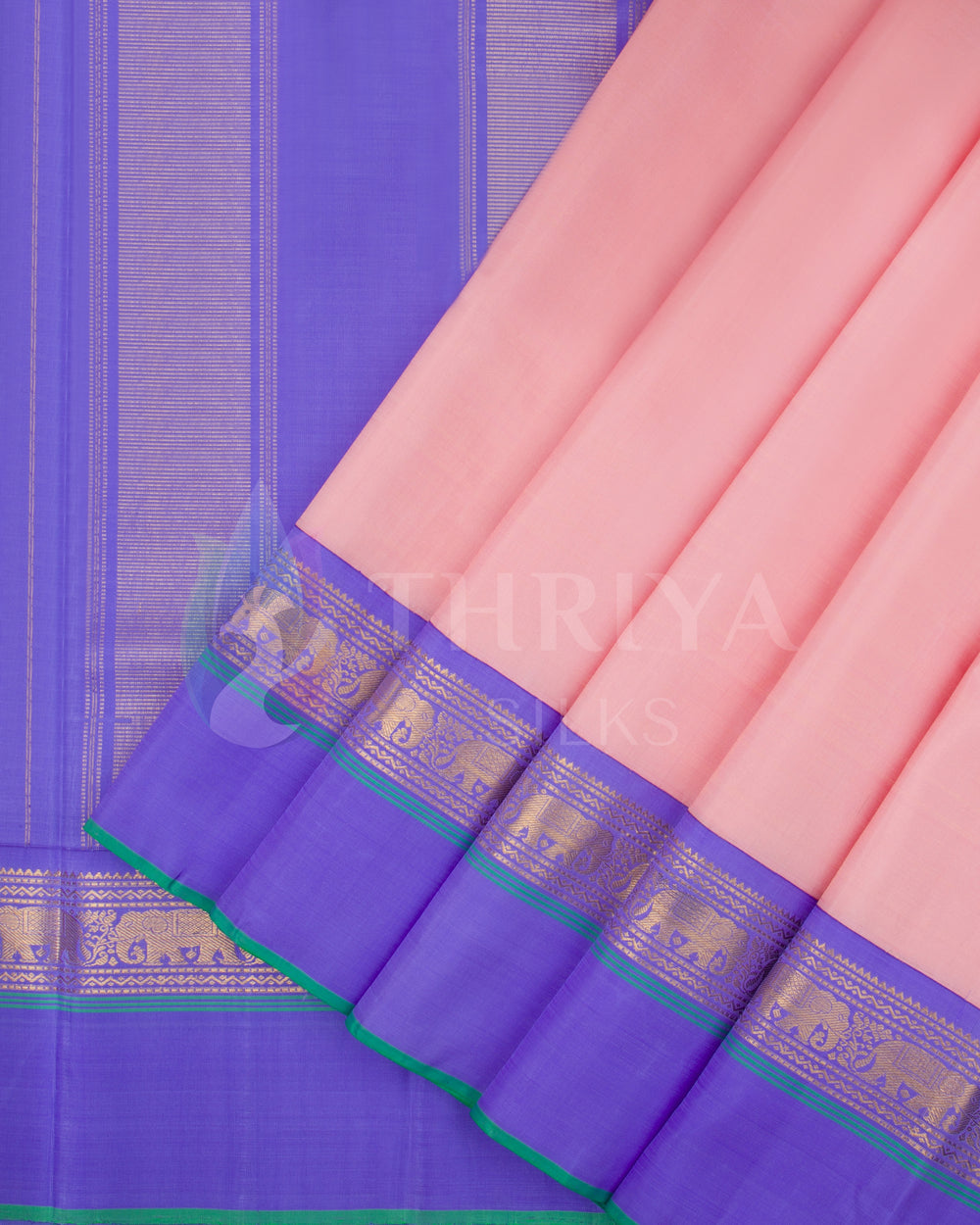 Pleats view of peach pink Kanjivaram silk saree with contrasting violet border and golden zari work