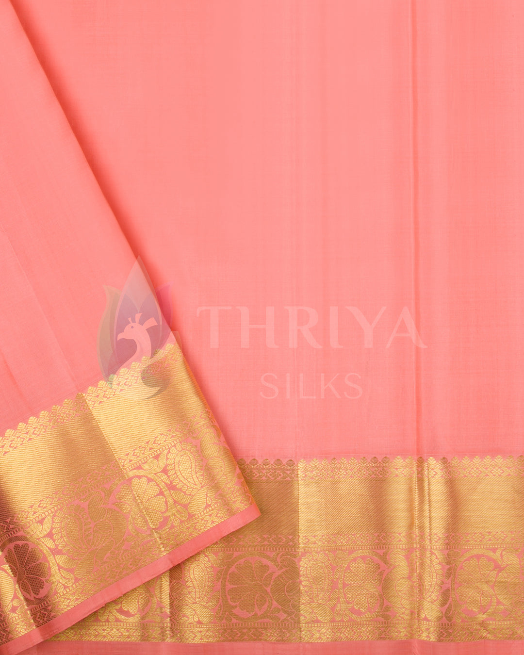 Plain peach-pink blouse piece with gold zari border matching the saree pallu