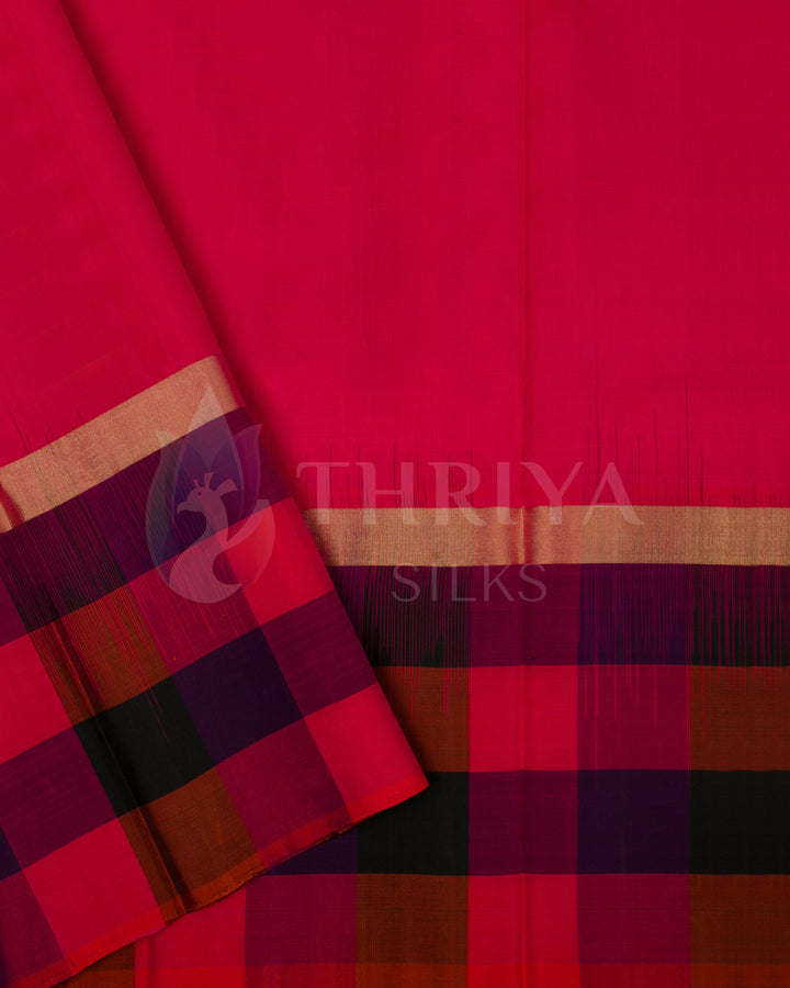 Pink blouse piece with multicolor border, complementing the Kanchipuram silk saree