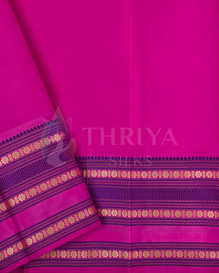 Pink blouse piece with gold zari border complementing purple silk saree, Thriya Silks