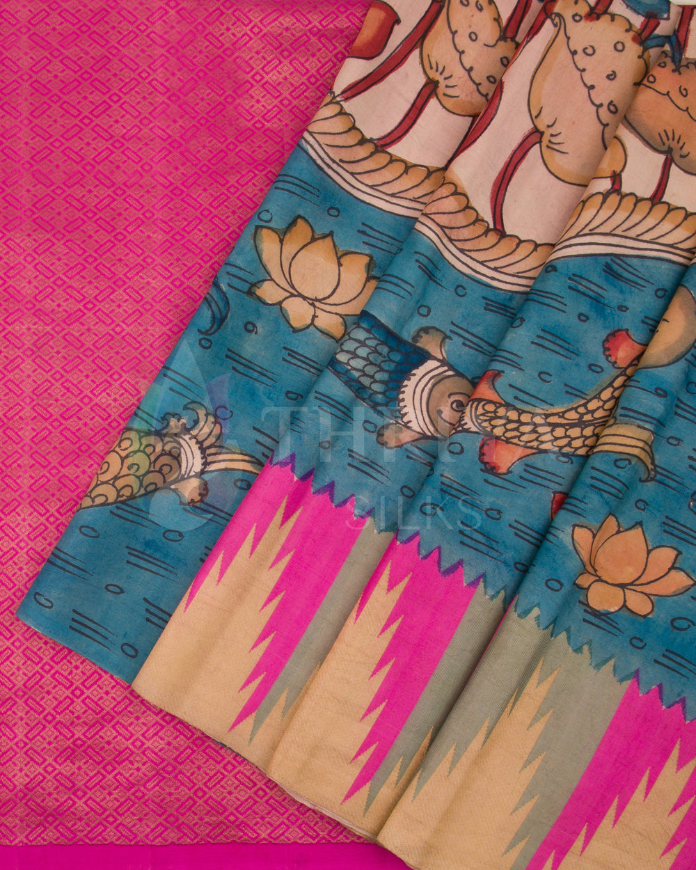  Close-up of pleats showing Kalamkari fish motifs and zig-zag border design on pink and blue silk saree.
