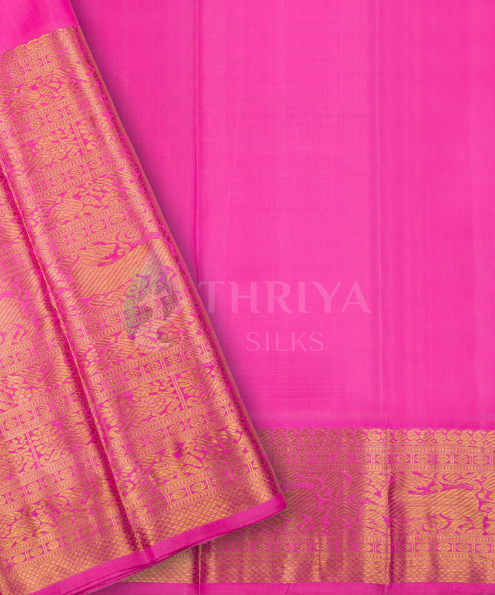 Graceful pink Kanchipuram silk saree with rich gold zari border and minimalistic body design