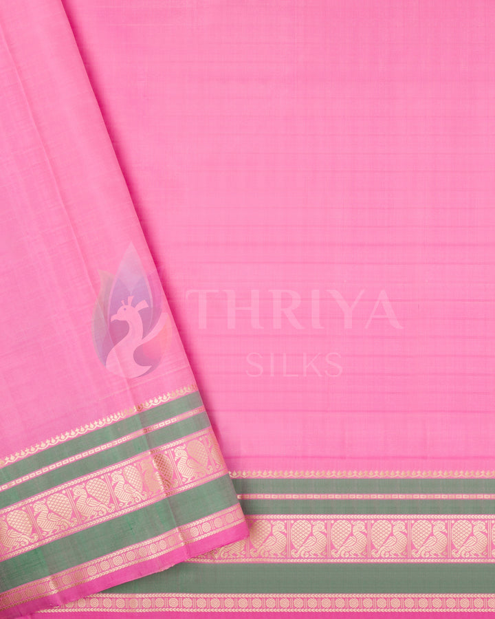 Pink blouse piece with gold and green zari border from beige Kanjivaram saree set