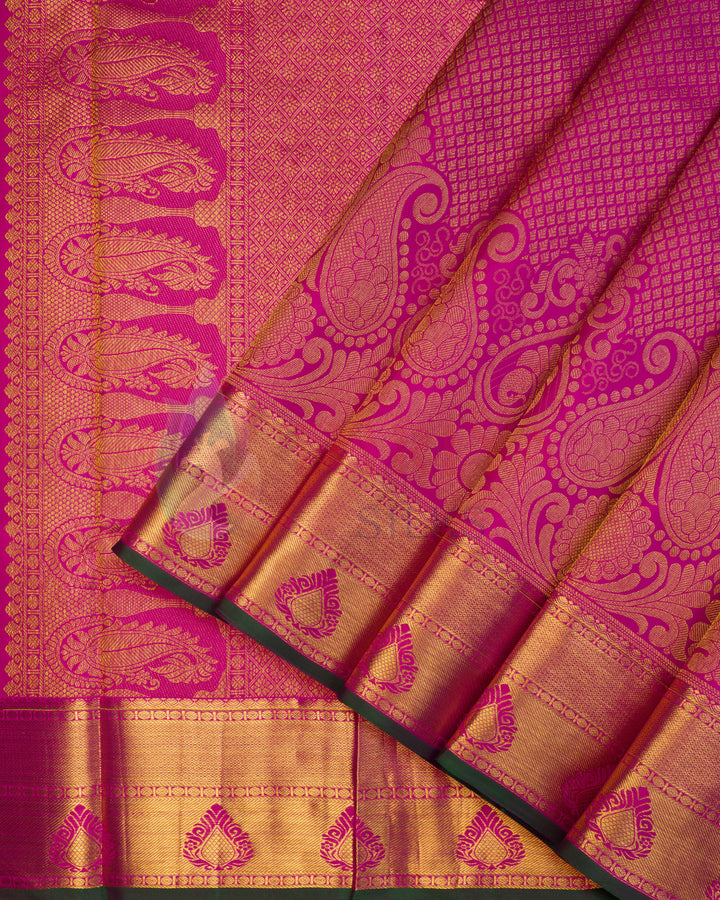 Pink Kanjivaram silk saree with golden zari mango motifs and diamond pattern weave