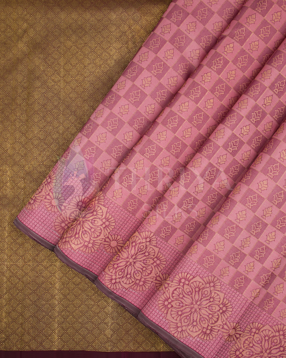 Pink Kanjivaram silk saree pleats with golden check pattern and brown zari border