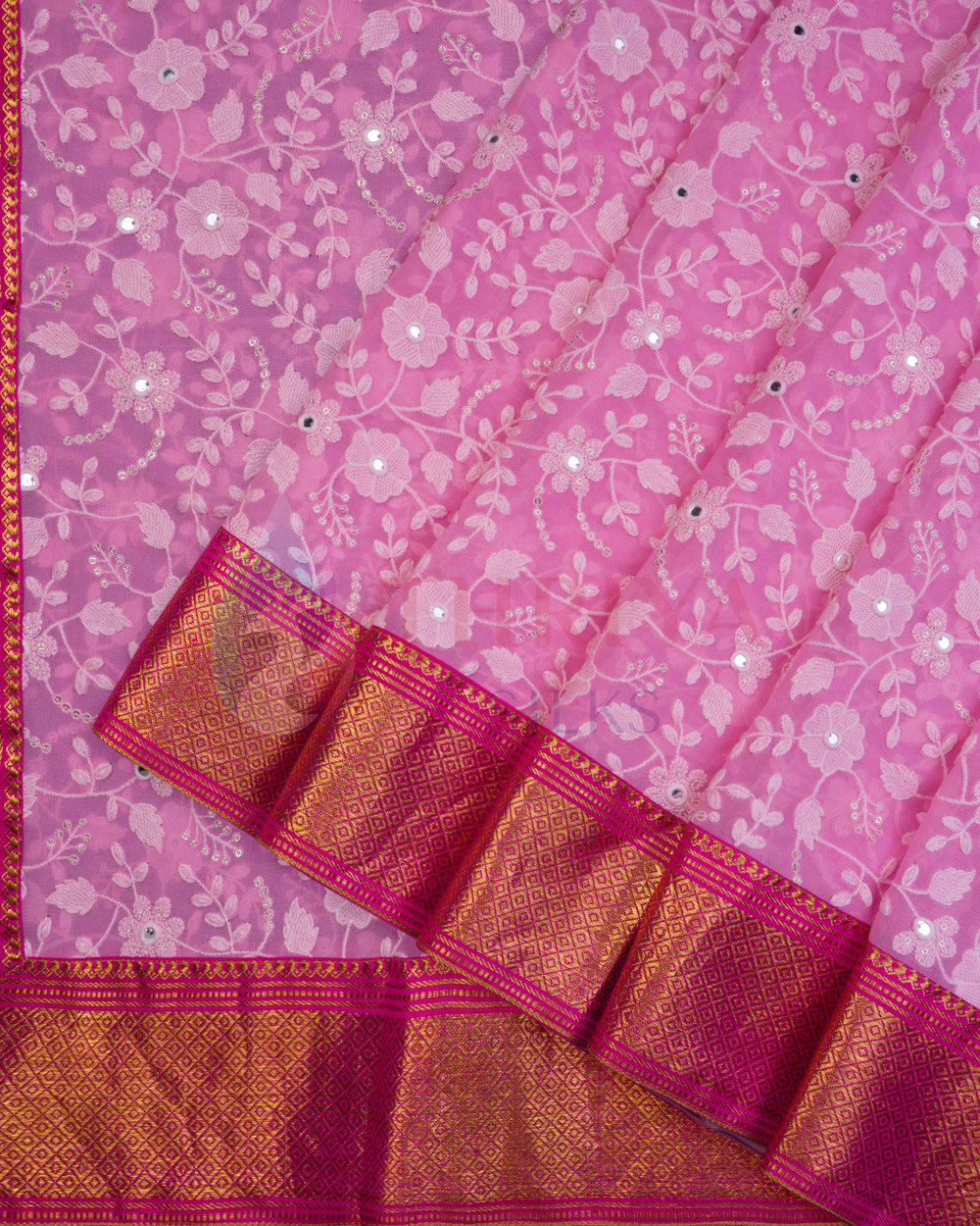Pink Chikankari silk saree with floral patterns and red-gold Kanchi border, folded flat view