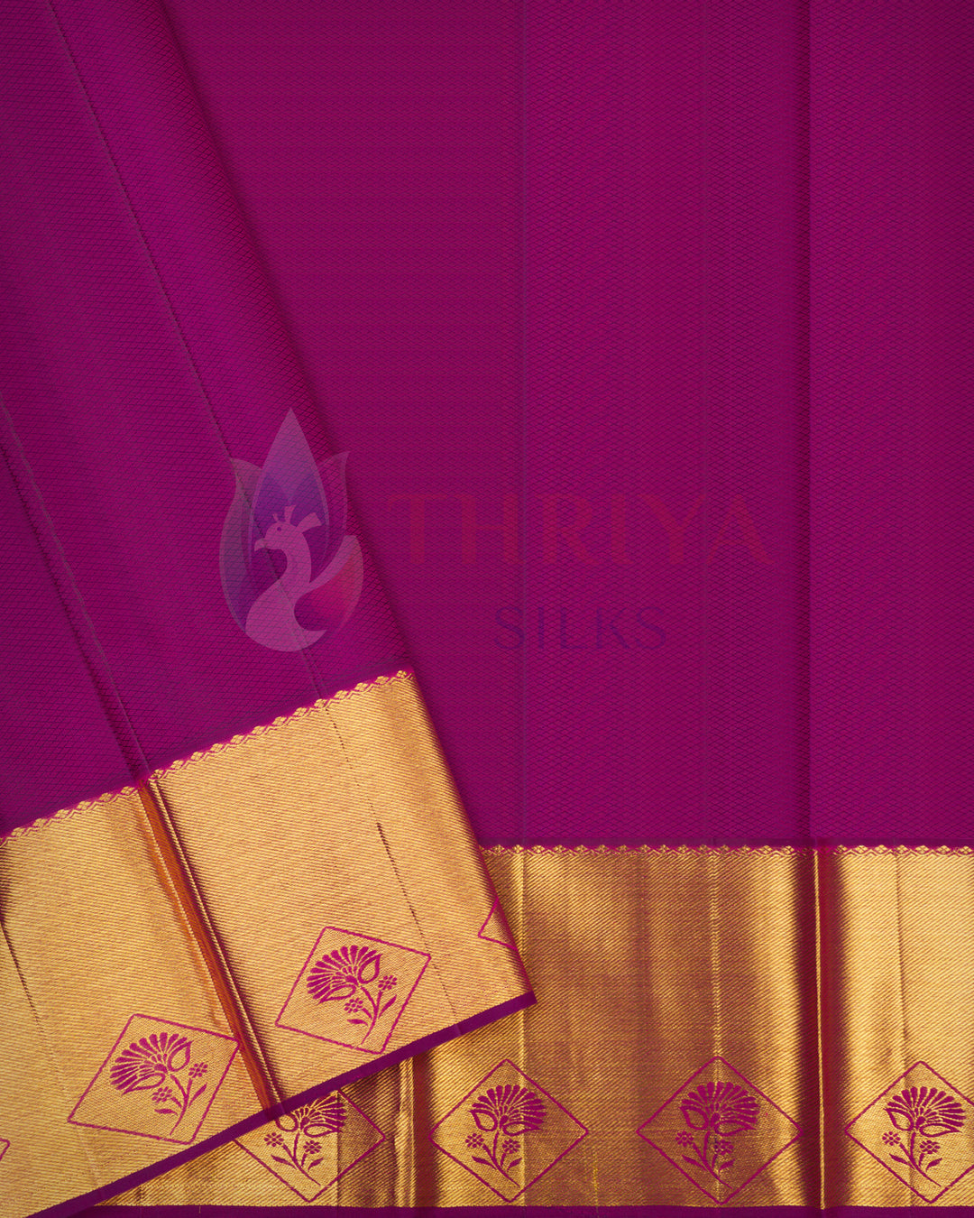 Plain body view of magenta Kanjivaram silk saree with elegant gold woven border