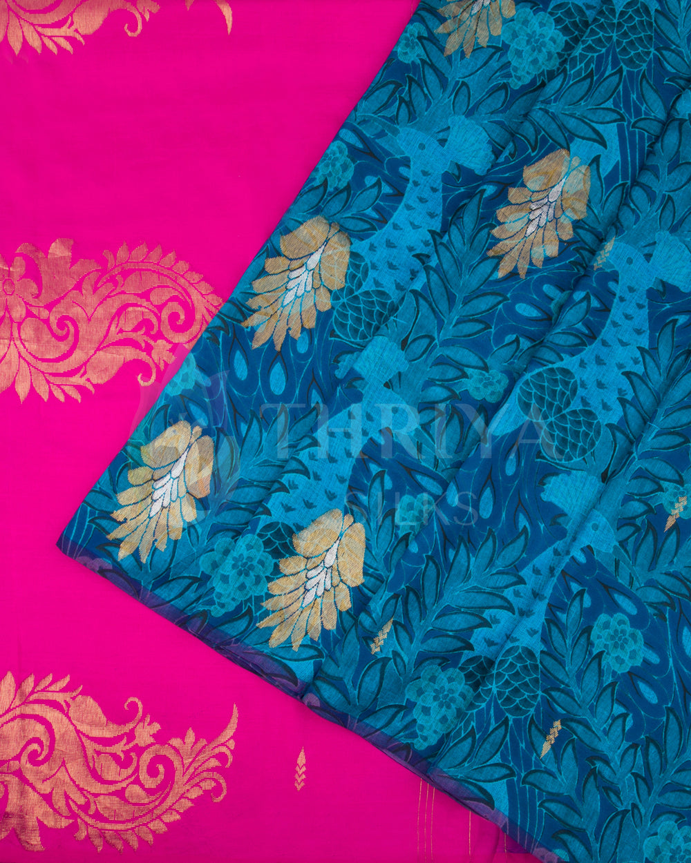Pleated view of the saree highlighting contrast between royal blue Banarasi body and bright pink pallu.
