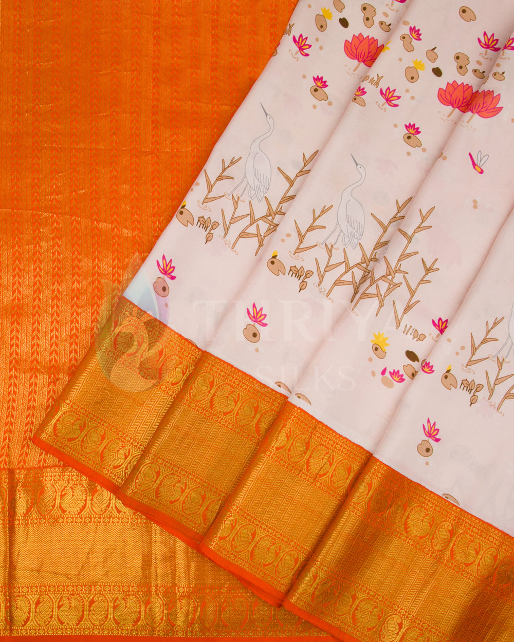 Pleated view showcasing detailed bird and lotus design with a vibrant orange zari pallu and border.