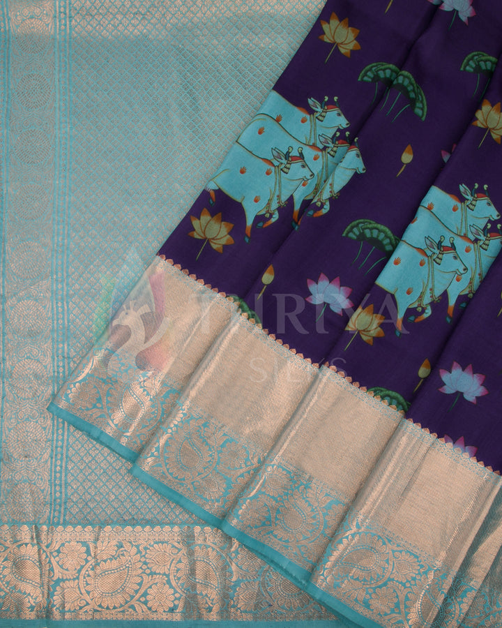 Pleated view highlighting sky blue elephant motifs, floral patterns, and silver zari detailing.