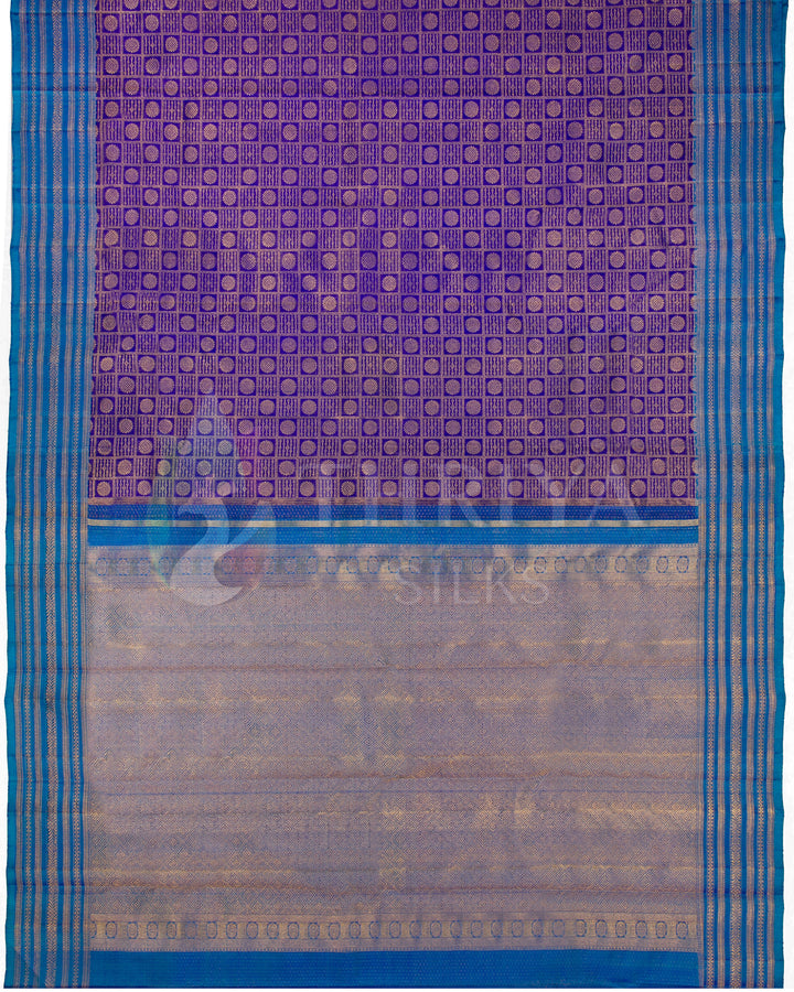 Full pallu view of royal purple and blue Kanjivaram silk saree with golden jacquard and zari border