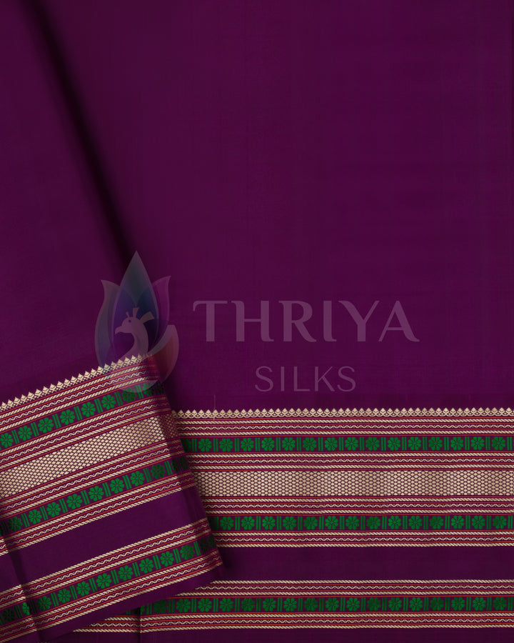 Purple blouse piece with green and gold zari border from peach and purple Kanjivaram saree set