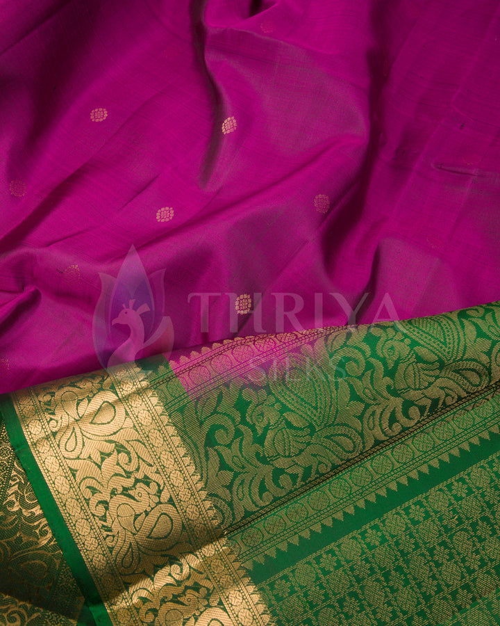 Close-up of purple silk saree with green and gold zari rich border