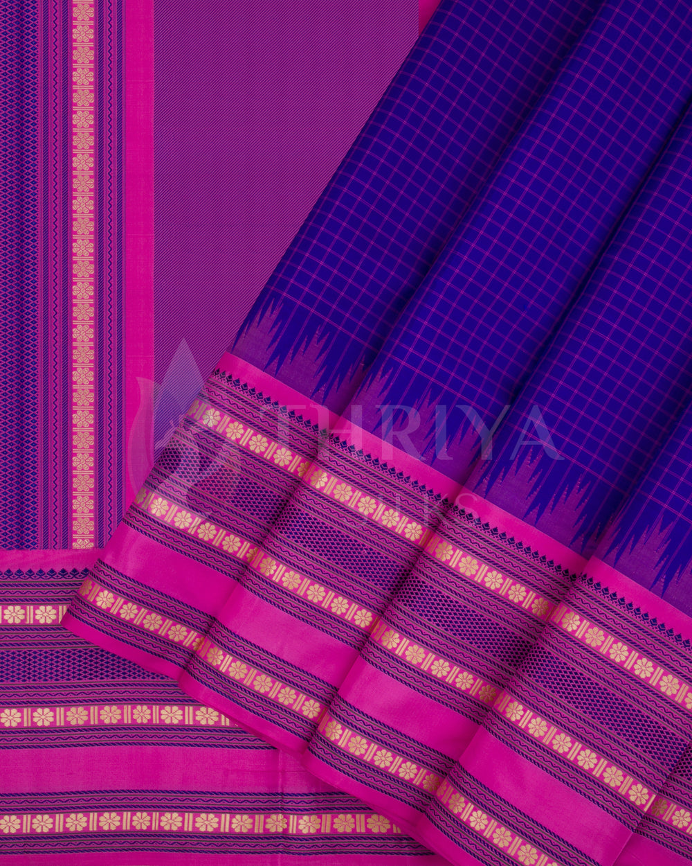 Purple silk saree with pink and gold zari border showing pleats, from Thriya Silks