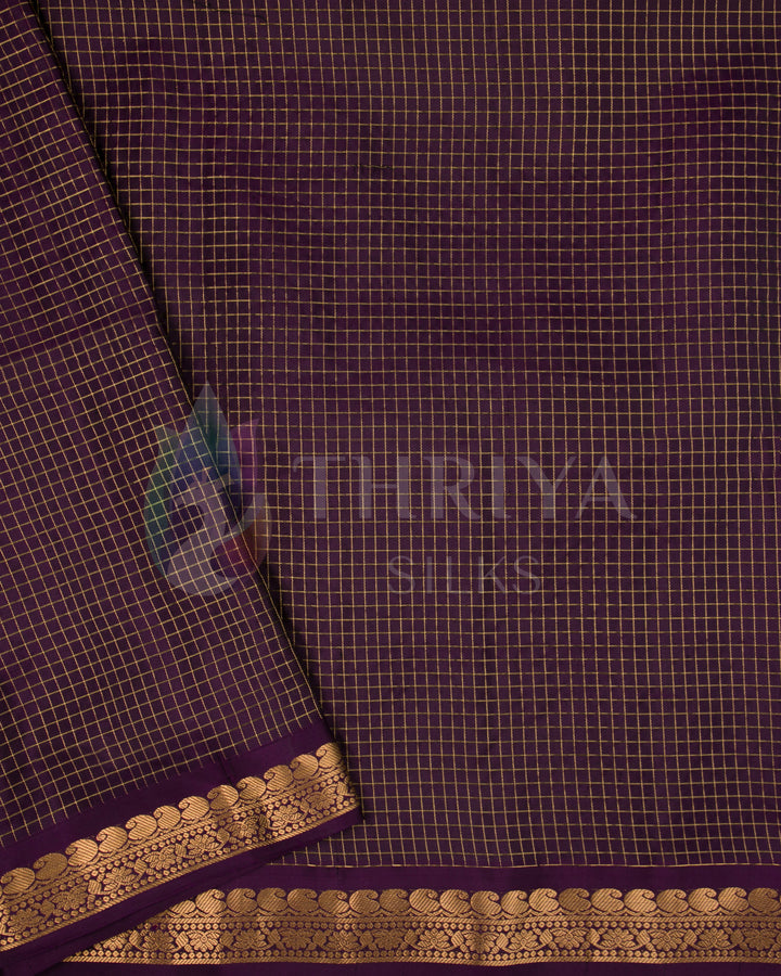 Plain purple blouse piece with gold zari stripes and floral border.