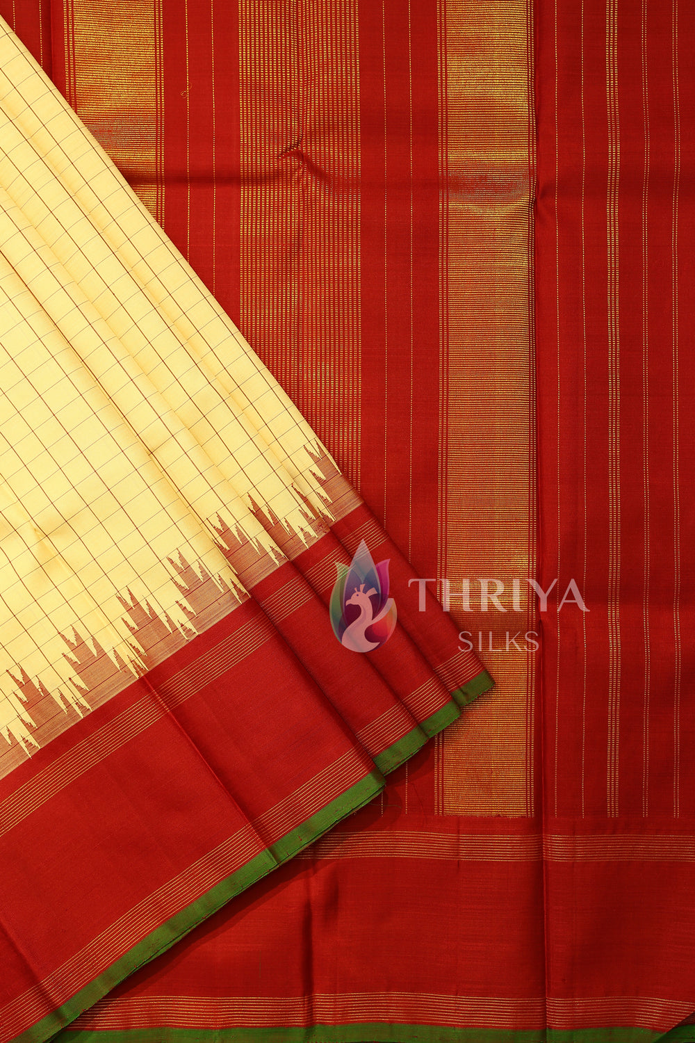 Elegant red pallu with vertical zari stripes on cream-checked saree