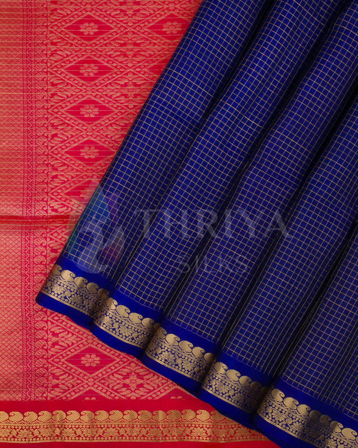 Royal blue Kanjivaram silk saree with red zari pallu and traditional gold border