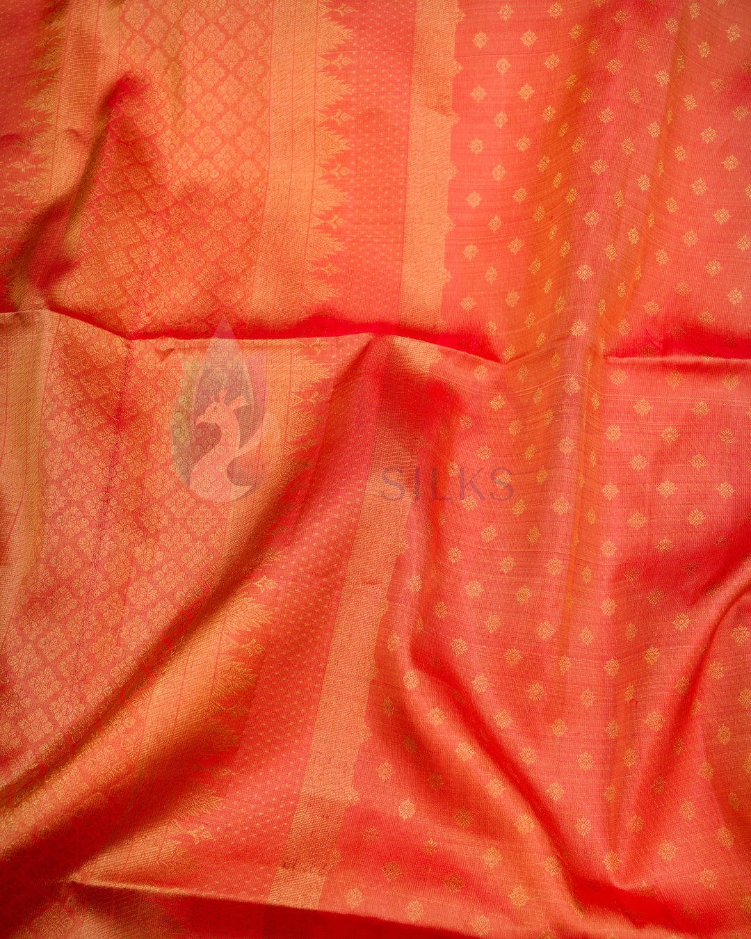Traditional rust-orange dupatta featuring gold detailing and red fringe finish