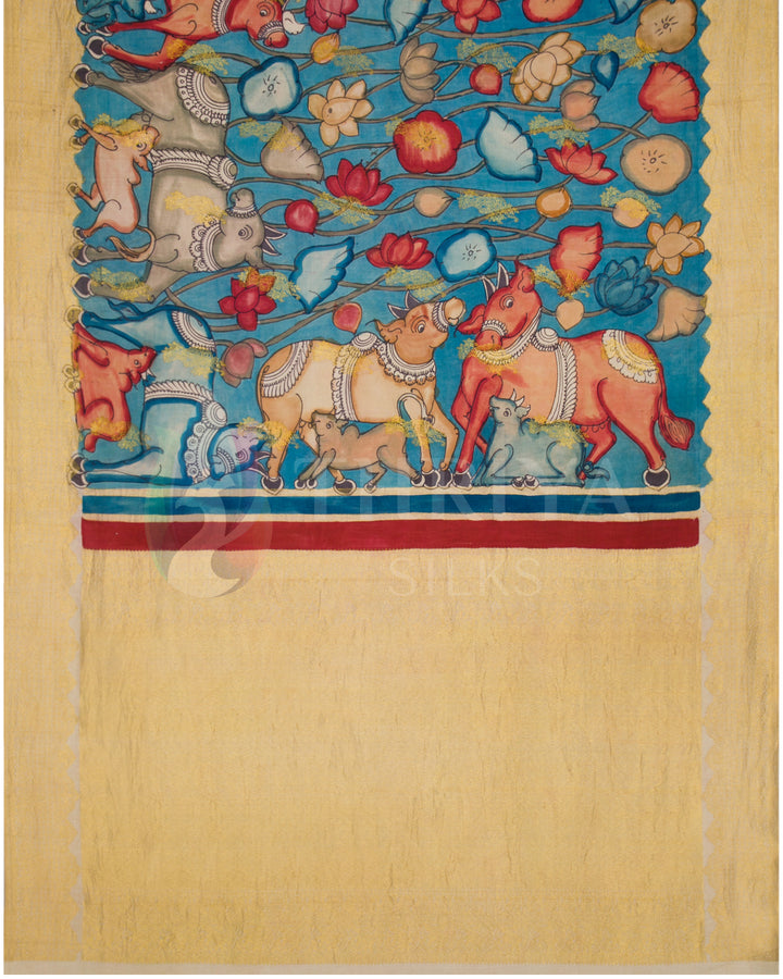Full body view of sky blue Kalamkari silk saree with intricate hand-painted animal and floral motifs.