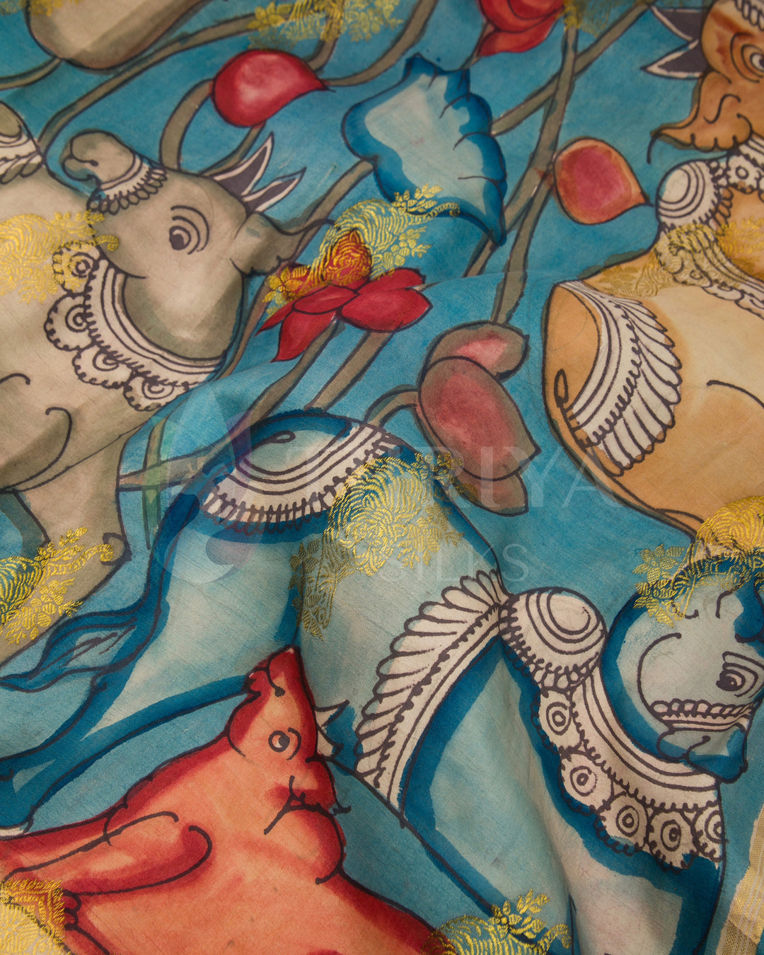 Vibrant hand-painted animal motifs on sky blue Kalamkari silk saree close-up.