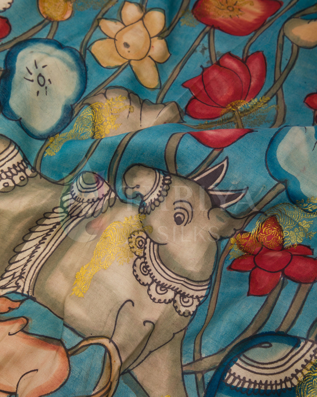 Detailed view of pallu featuring colorful hand-painted Kalamkari animal and floral motifs